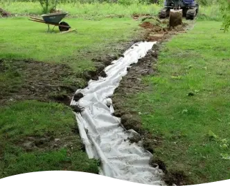 Newly installed curtain drain in yard